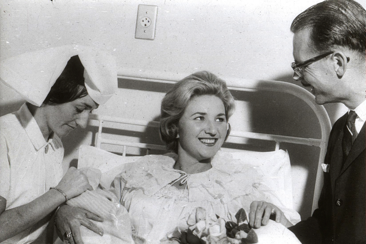 Doctor and nurse caring for woman, Sandringham history