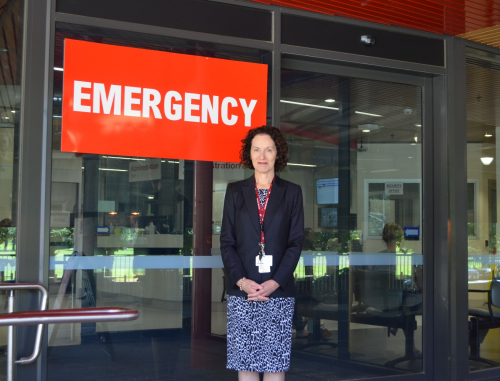 Dr Helen Ackland standing in front of Emergency at The Alfred