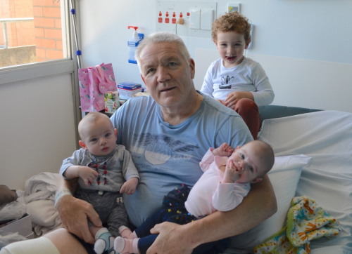 Wayne Pick at The Alfred, with his grandchildren Lennox, Pippa and Greyson, following a lower leg amputation.