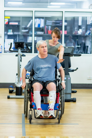 Alfred Health staff member with NDIS patient in wheelchair