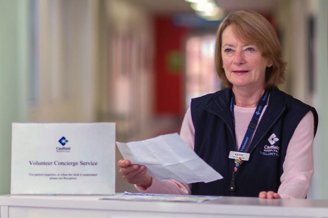 Female volunteer at reception desk