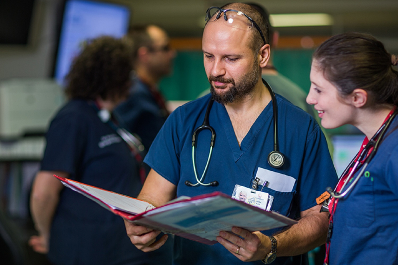 Doctors looking at patient file